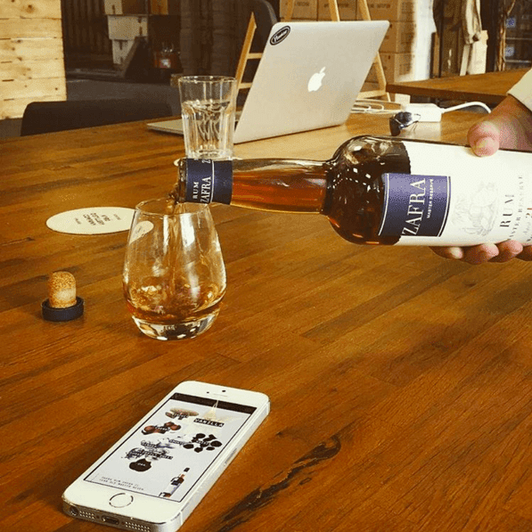 Zafra Rum Being Poured in Flaviar Office Zafra Rum Being Poured in Flaviar Office