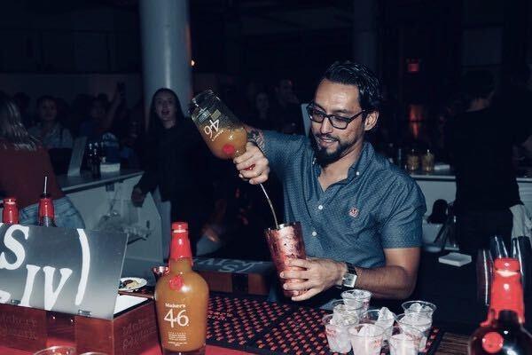 Clinth Lopez Pours a drink Clinth Lopez Pours a drink